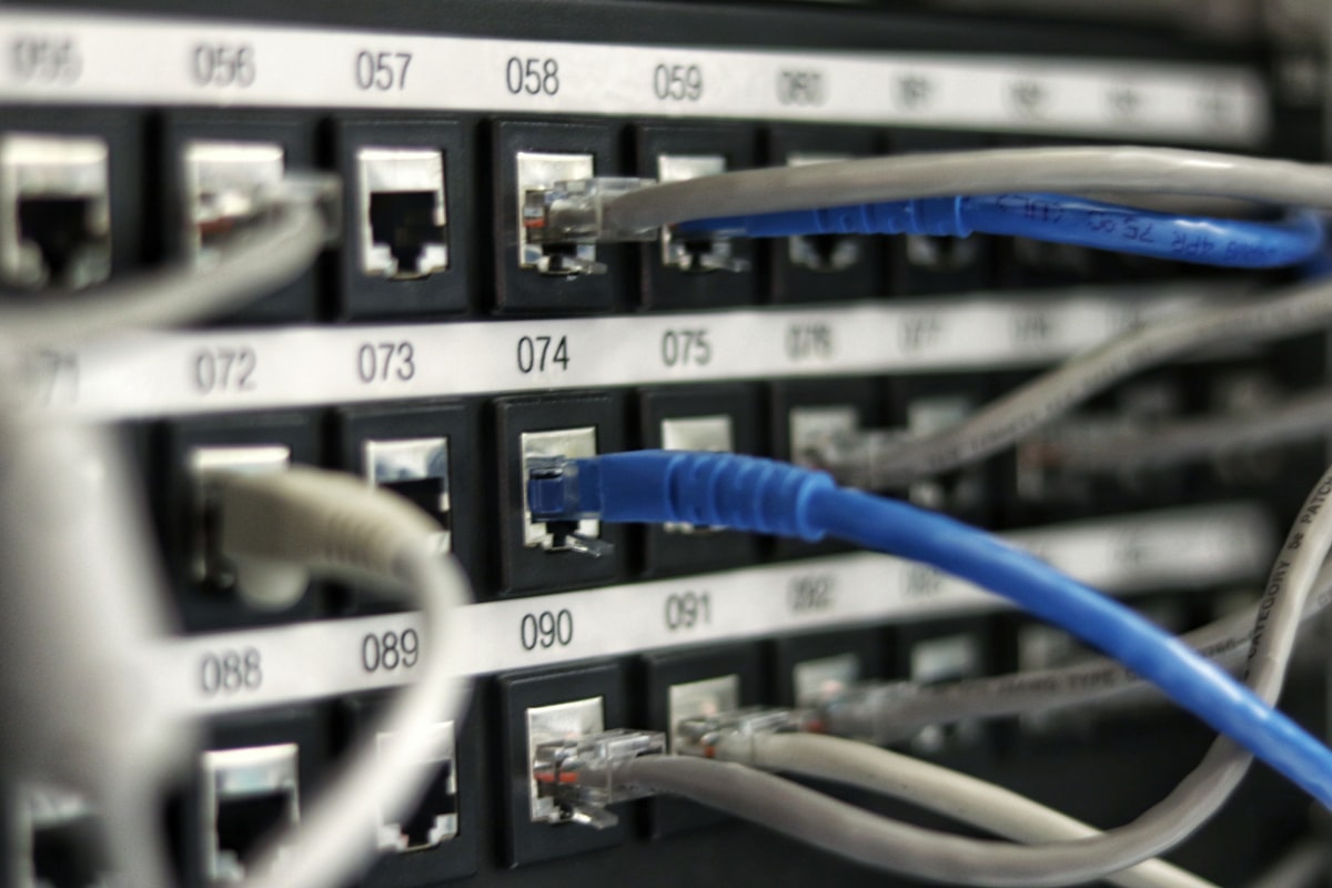 Server rack with status indicators representing GPU uptime and reliability